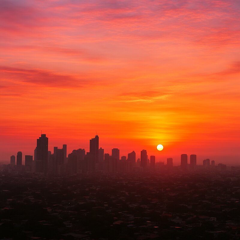 Beautiful sunrise over Manila skyline with colorful pink and orange sky